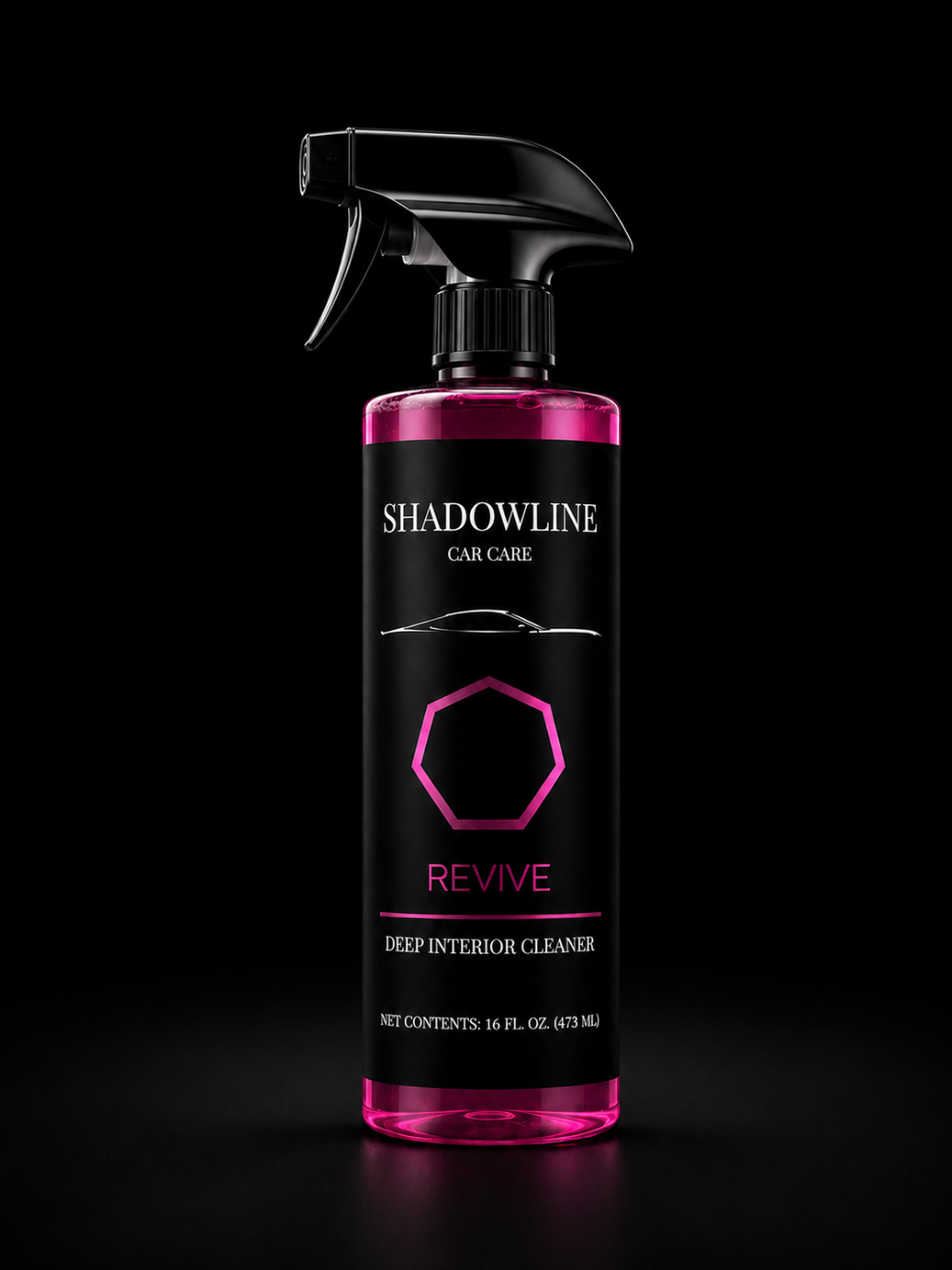 Pink and black bottle of Shadowline Car Care Revive Deep Interior Cleaner on a black background