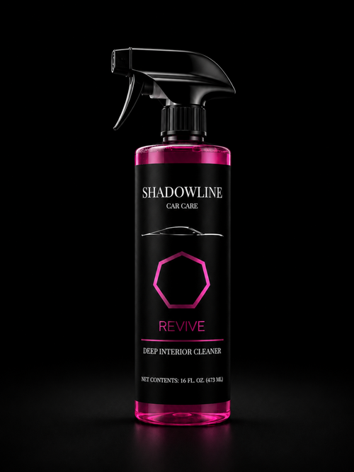 Pink and black bottle of Shadowline Car Care Revive Deep Interior Cleaner on a black background